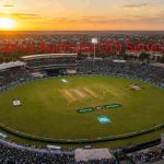 Aerial view of Rawalpindi Cricket Stadium during Pakistan vs Australia cricket match with packed crowd and golden sunset lighting